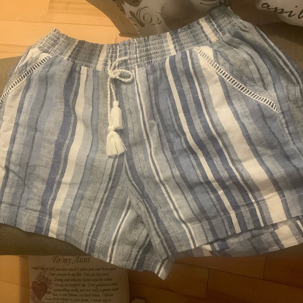 Nice plaid Shorts made by Briggs size Large with drawstring,stretch waist.